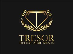 un logotipo de treeograma dorado con una estrella dorada en TRESOR Delux Apartment, en Osijek