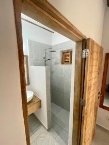 a bathroom with a shower and a sink at Nakupenda paje villa in Paje