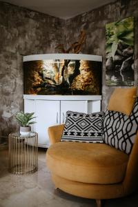 a living room with a couch and a chair at La Cataleya in San Agustin