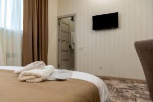 Voodi või voodid majutusasutuse Aeka hotel toas