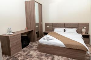 Voodi või voodid majutusasutuse Aeka hotel toas