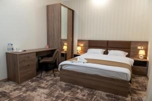 Voodi või voodid majutusasutuse Aeka hotel toas