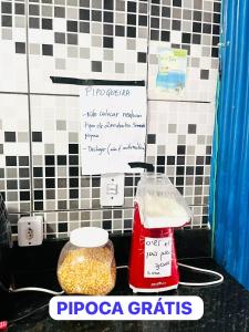 a counter with a bag of food and a container of peanuts at adriana hostel in Itacaré