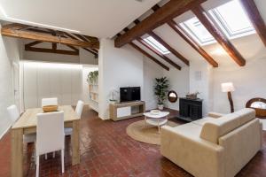 a living room with a couch and a table at Matteotti Gallery Venice Apt in Mestre
