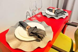 a table with a plate with a man in a suit on it at The Birthplace of Samba Carioca in Rio de Janeiro
