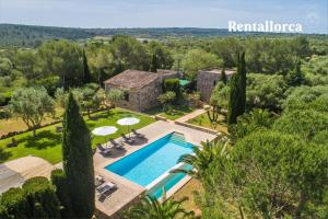 an aerial view of a villa with a swimming pool at Finca Son Guillotet by Rentallorca in Maria de la Salut