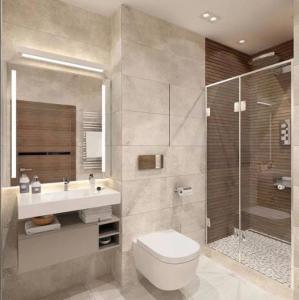 a bathroom with a toilet and a sink and a shower at شقه حديثه علي النيل in Minya