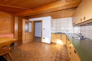 a kitchen with a sink and a counter top at Appartment Lanz in Dobbiaco