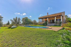 a house with a swimming pool in the yard at S'Albufereta by Rentallorca in Alcudia