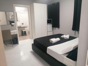 MY DREAM في كابو دورلاندو: غرفة نوم عليها سرير وفوط