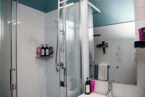 a bathroom with a shower and a sink at AL NIDO LEGAMI Charme&Relax in Bergamo +7 photos