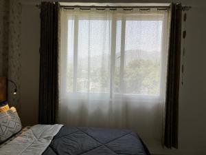 Postel nebo postele na pokoji v ubytování Beautiful 1 BHK in Dehradun