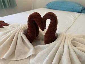 A bed or beds in a room at BEST ONE 2BD Shared Pool A3 5 MIN TO NAI YANG BEACH