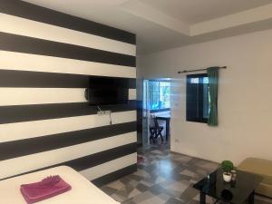 A bed or beds in a room at BEST ONE 2BD Shared Pool A3 5 MIN TO NAI YANG BEACH