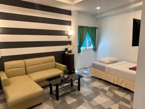 A bed or beds in a room at BEST ONE 2BD Shared Pool A3 5 MIN TO NAI YANG BEACH