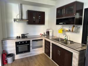 A kitchen or kitchenette at BEST ONE 2BD Shared Pool A3 5 MIN TO NAI YANG BEACH