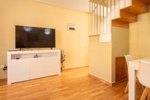 Televízia a/alebo spoločenská miestnosť v ubytovaní Casa unifamiliar