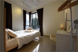 a bedroom with a large bed and a window at Myuko Homestay (2-7 pax) 10min to BOH in Brinchang