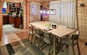 a dining room table and chairs in a kitchen at 4 Bedroom Pet Friendly Home In Tydal in Tydal