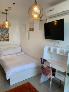 ThePenthouse Coliving II客房内的一张或多张床位