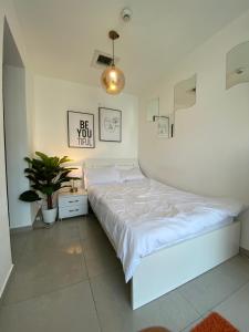 ThePenthouse Coliving II客房内的一张或多张床位
