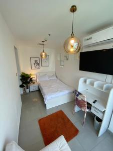 ThePenthouse Coliving II客房内的一张或多张床位
