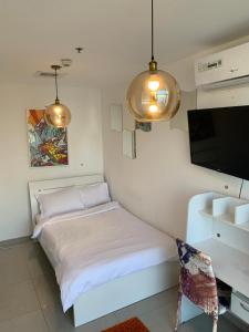 ThePenthouse Coliving II客房内的一张或多张床位