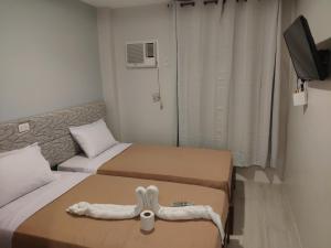 Postel nebo postele na pokoji v ubytování D' Loft Iligan