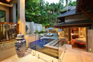 a house with a vase in the middle of a room at Paradiso Pavilion - An Intimate Bali-style Haven in Port Douglas