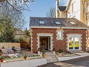 a brick house with a porch and a patio at 2 Bed in Torquay 82540 in Torquay