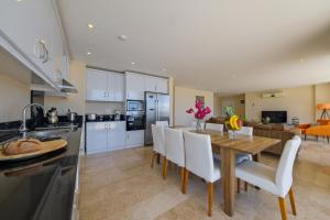 a kitchen and dining room with a table and chairs at Lumiere Villas 2 in Kalkan