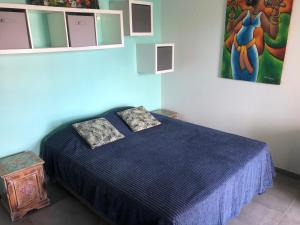 Llit o llits en una habitació de CoCoKreyol - Ti CARAYOU