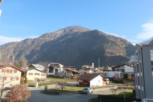 a town with a mountain in the background at C A L M au Cœur du Valais in Riddes
