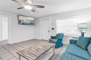 a living room with a couch and a table at Blackfin Resort and Marina in Marathon