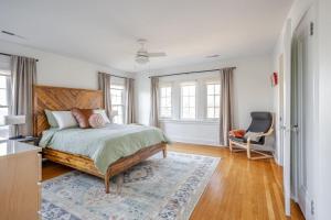 a bedroom with a bed and a chair in it at Avon Hills Quiet, 4B 1920s Tudor with Vintage Charms in Cincinnati