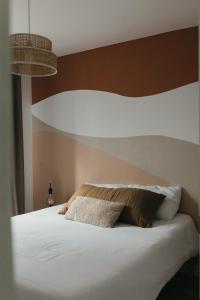 Postelja oz. postelje v sobi nastanitve Le Comptoir de Constantin