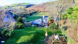 an aerial view of a house on a hill at Fern Cottage Annexe in Croyde