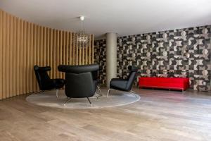A seating area at Nun Apartments by BnbHost
