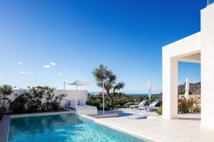 a villa with a swimming pool with a view at Villa Venetiko - Refined Minimalist Villa with Sunset Bliss by etouri in Chania