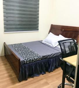 a bed with a wooden headboard in a room at Tiny House Air BnB in San Antonio
