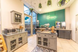 a room with a kitchen with a counter top at Break & Home Paris Italie Porte de Choisy in Ivry-sur-Seine