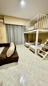 a room with two bunk beds and a staircase at Eno’s Apartment 2 in Vlorë
