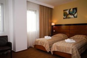 Ένα ή περισσότερα κρεβάτια σε δωμάτιο στο HOTEL CRISS +39 φωτογραφίες
