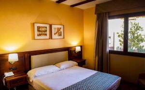 Postel nebo postele na pokoji v ubytování Hotel Spa Tudanca Aranda