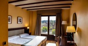Postel nebo postele na pokoji v ubytování Hotel Spa Tudanca Aranda