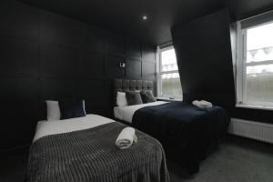 Postel nebo postele na pokoji v ubytování Amsterdam Hotel