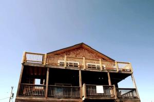 a large wooden building with decks on it at Amazing Ocean View-Newly Renovated Modern Oasis in Avon