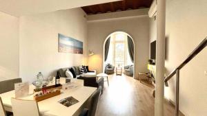 a living room with a couch and a table at Paseo de Gracia Design in Barcelona