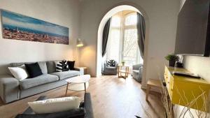a living room with a couch and a table at Paseo de Gracia Design in Barcelona