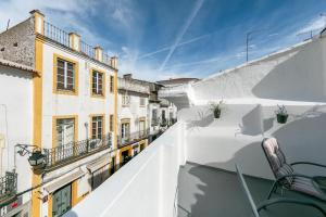 a view from the balcony of a building at Home near Évora's main square with private terrace in Évora